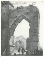 Travellers beneath a Ruined Arch