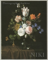 Flowers in a Glass Vase on a Draped Table