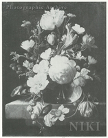 Roses and Other Flowers in a Glass Vase on a Stone Table