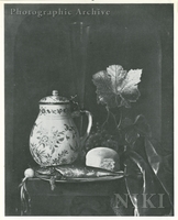 Still Life with a Delft Tankard, a Flute Glass, a Herring and a Bread Roll on a Pewter Plate, an Onion and a Bunch of Grapes with Vine Leaves on a Table Covered by a Wine-coloured Velvet Cloth