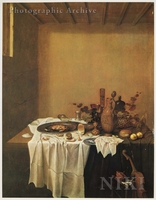 Still Life with a Crab on a Pewter Plate, a Peeled Lemon, a Bread Roll, Grapes, Rummers and Other Objects on a Table Partly Covered by a White Cloth, a Violin below