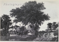 Wooded Landscape with a Village, a Pond, and Figures on a Path