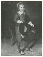 Portrait of a Boy Holding a Black Hat and a Dog